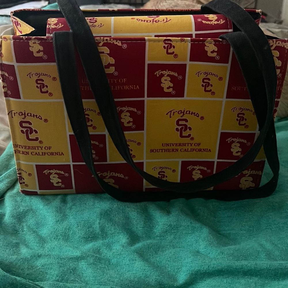 USC Trojan bag. Very gently used. Inside zipper. Comes with a wrist wallet.